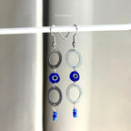 Stainless steel circle and blue evil eye bead statement dangle earrings