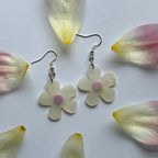 White and yellow or purple opaque flower earrings