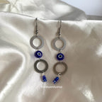Stainless steel circle and blue evil eye bead statement dangle earrings