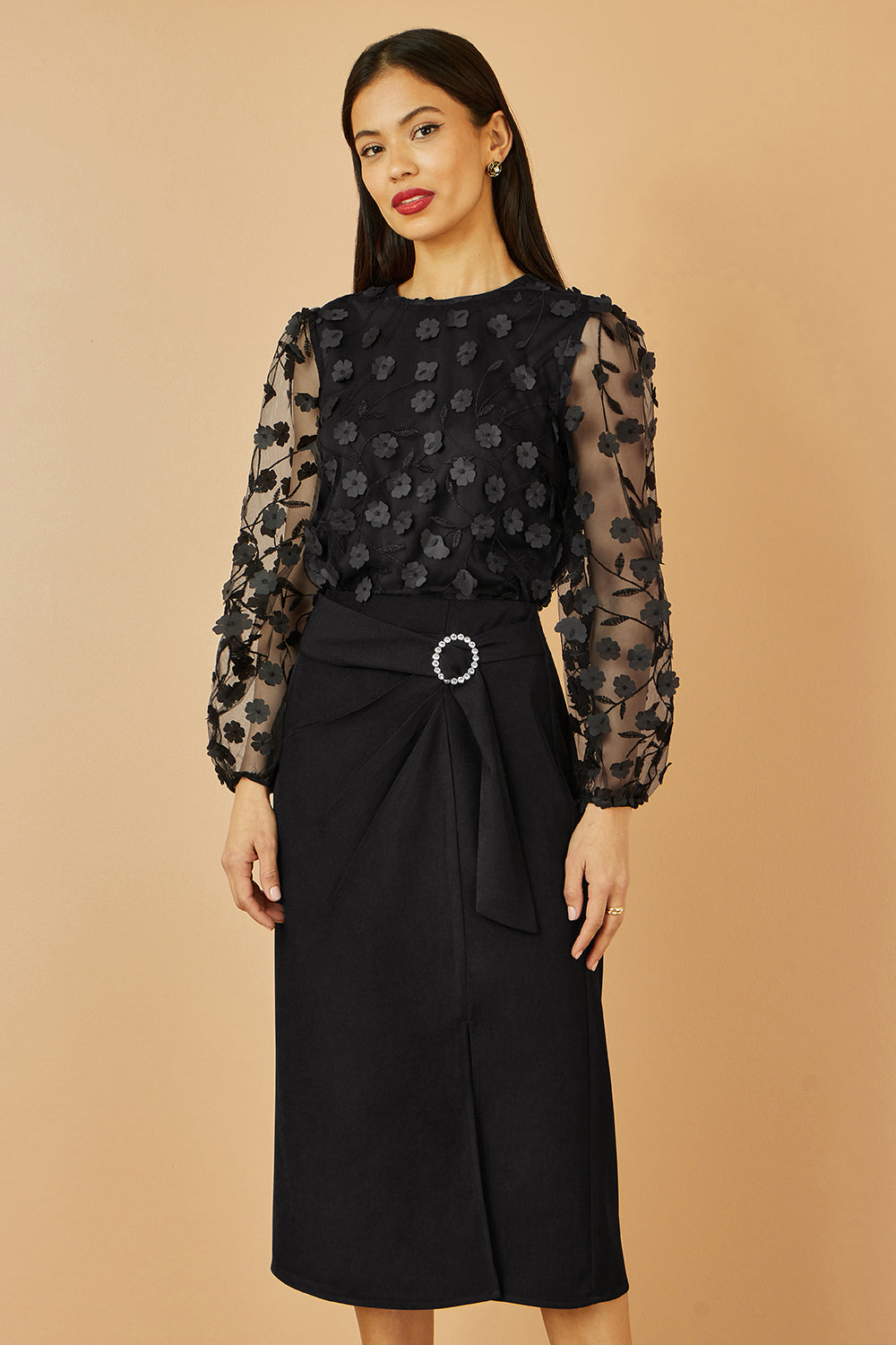 Top Yumi noir transparent à manches et fleurs appliquées