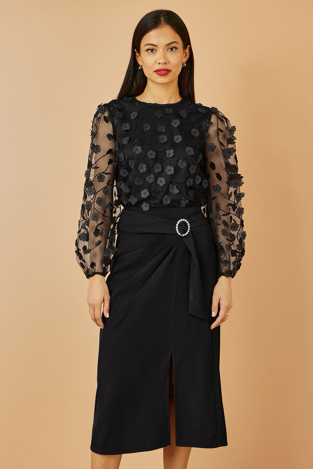 Top Yumi noir transparent à manches et fleurs appliquées