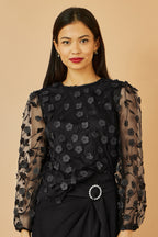 Top Yumi noir transparent à manches et fleurs appliquées