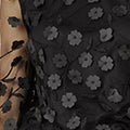 Top Yumi noir transparent à manches et fleurs appliquées