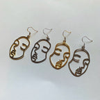 Silver or gold face outline earrings