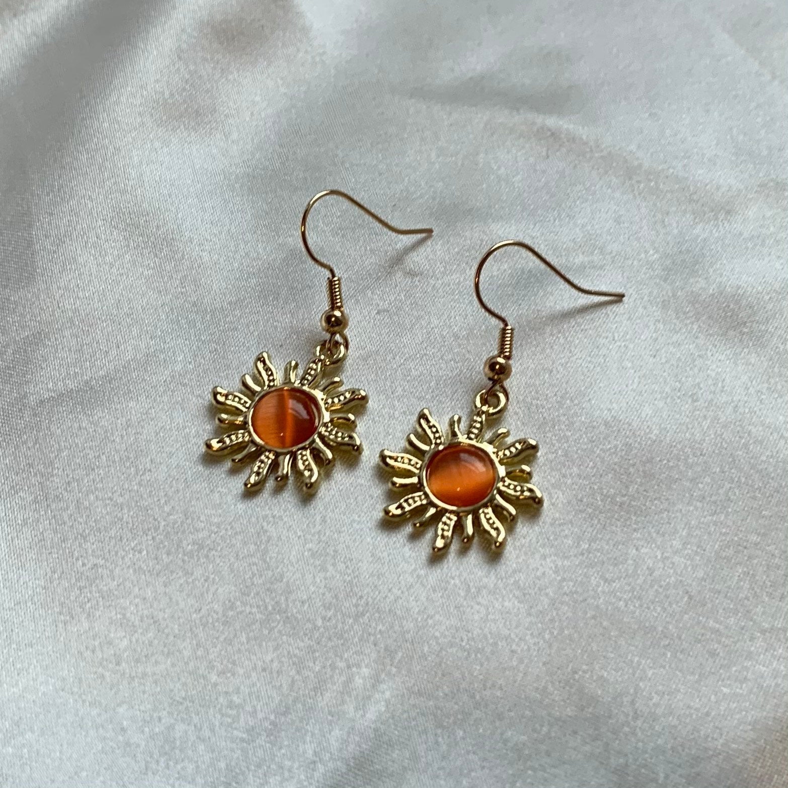 Cool quirky gold orange sun earrings with orange centre dangle earrings