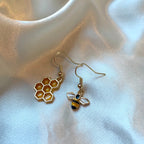 Cool quirky yellow and black gold bee drop dangle earrings with yellow honey comb