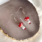 Cool quirky red and white glass lamp work drop dangle earrings on silver plated hooks.
